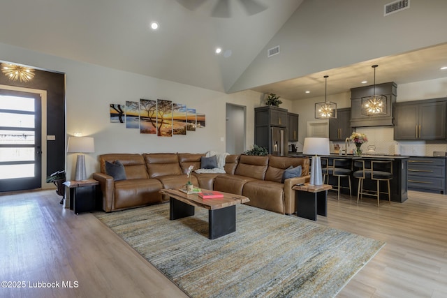 10907 Vicksburg Ave, Lubbock, TX 79424 - living room with light wood-style flooring, recessed lighting, high vaulted ceiling, and a ceiling fan
