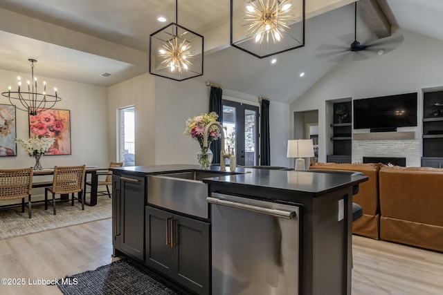 10907 Vicksburg Ave, Lubbock, TX 79424 - kitchen featuring stainless steel dishwasher, a chandelier, a sink, dark countertops, and light wood finished floors