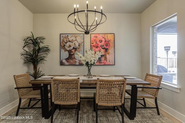 10907 Vicksburg Ave, Lubbock, TX 79424 - dining area with a chandelier, baseboards, healthy amount of natural light, and wood finished floors