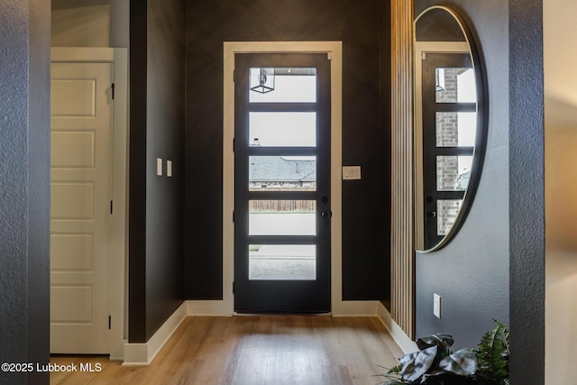 10907 Vicksburg Ave, Lubbock, TX 79424 - entrance foyer with light wood-type flooring and baseboards
