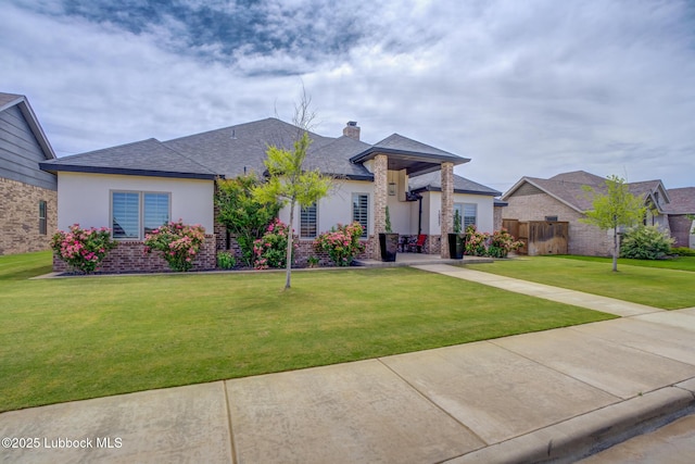 10907 Vicksburg Ave, Lubbock, TX 79424 - ranch-style home featuring a chimney, stucco siding, a shingled roof, and brick siding
