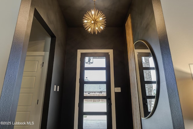 10907 Vicksburg Ave, Lubbock, TX 79424 - entryway featuring a chandelier and healthy amount of natural light