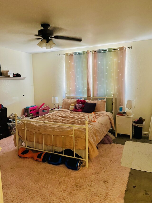306 Parkwood Ln, Levelland, TX 79336 - bedroom with carpet flooring and a ceiling fan