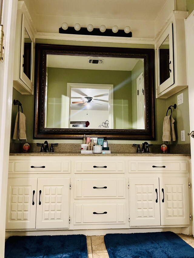 306 Parkwood Ln, Levelland, TX 79336 - bathroom with double vanity, ceiling fan, and tile patterned flooring