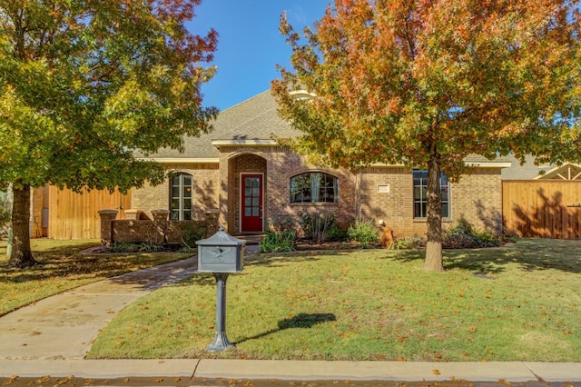 view of front of home with a front lawn