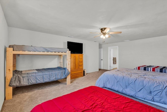 carpeted bedroom featuring a ceiling fan