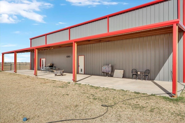 back of property with a patio