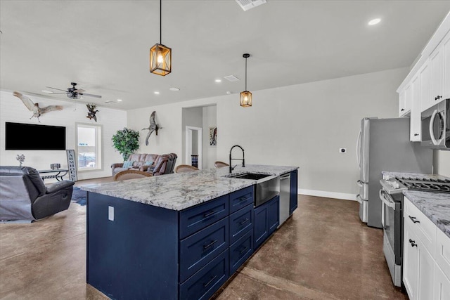 kitchen with blue cabinetry, finished concrete floors, appliances with stainless steel finishes, white cabinetry, and a sink
