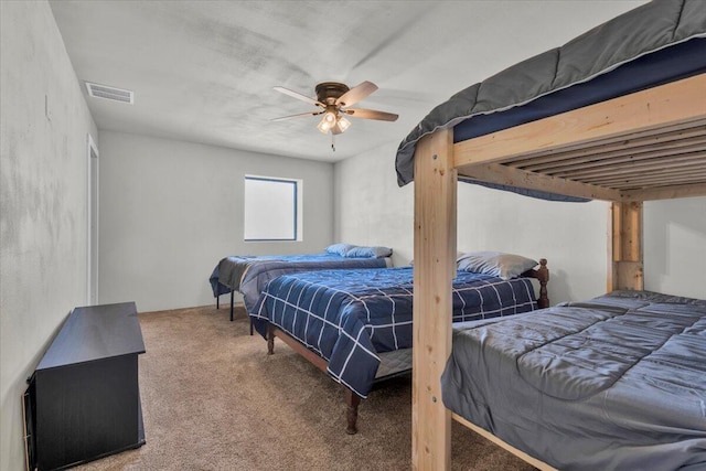 bedroom featuring visible vents, carpet floors, and ceiling fan