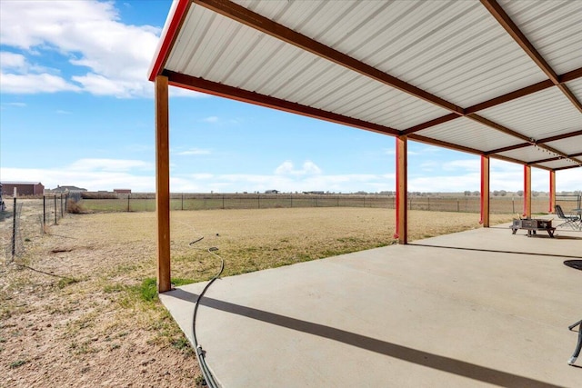 view of patio with a rural view and a fenced backyard
