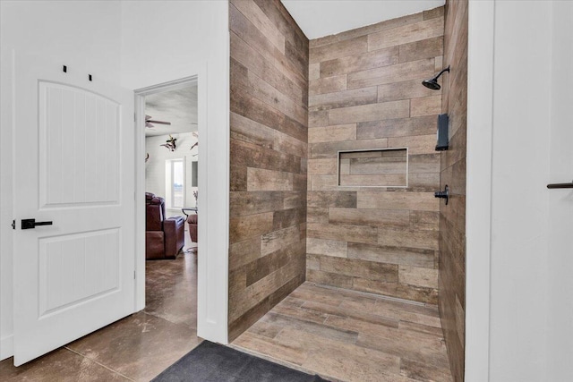 bathroom featuring a tile shower