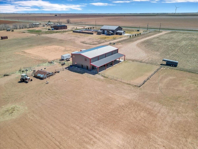 birds eye view of property featuring a rural view