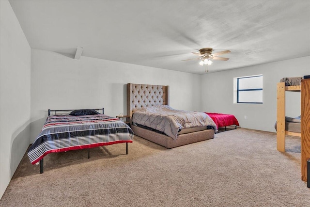 bedroom with a ceiling fan and carpet floors