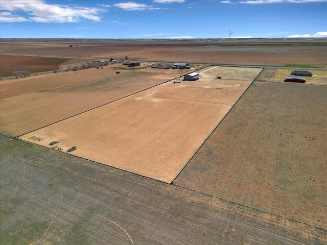 birds eye view of property featuring a rural view