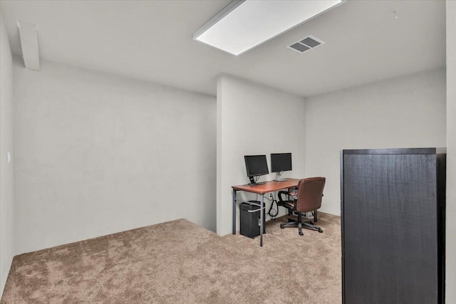 office area featuring visible vents and carpet
