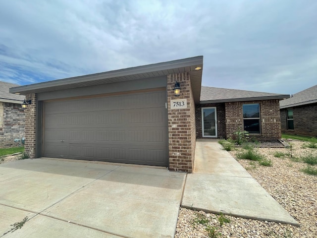 ranch-style home featuring a garage