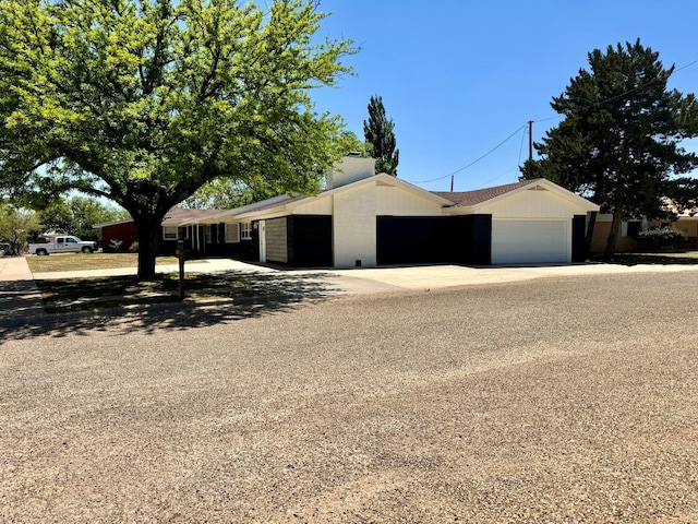 ranch-style house featuring a garage