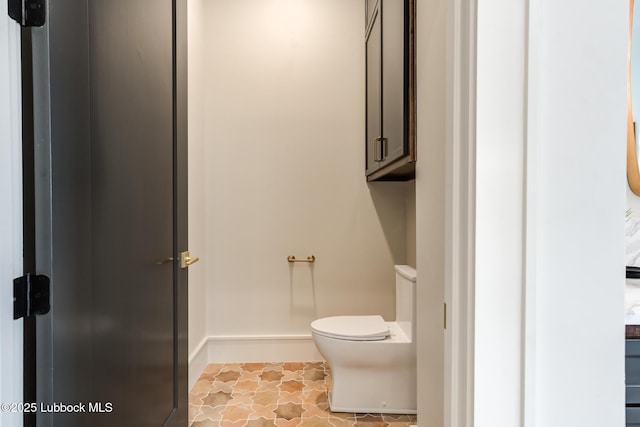 4510 Zadar Ave, Lubbock, TX 79407 - bathroom featuring toilet and baseboards