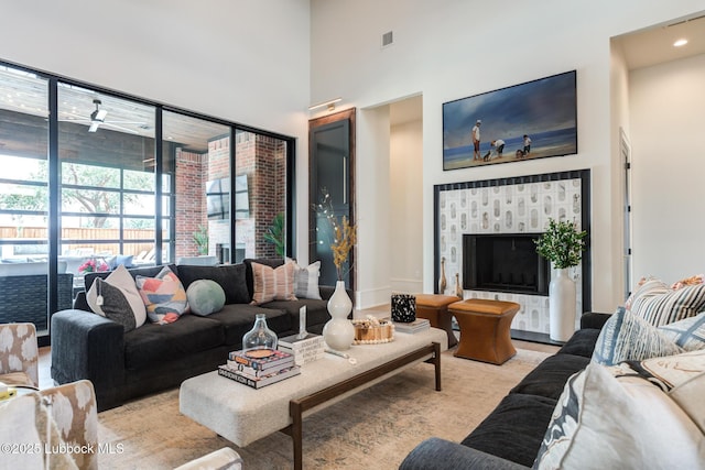 4510 Zadar Ave, Lubbock, TX 79407 - living area featuring a high ceiling and a fireplace