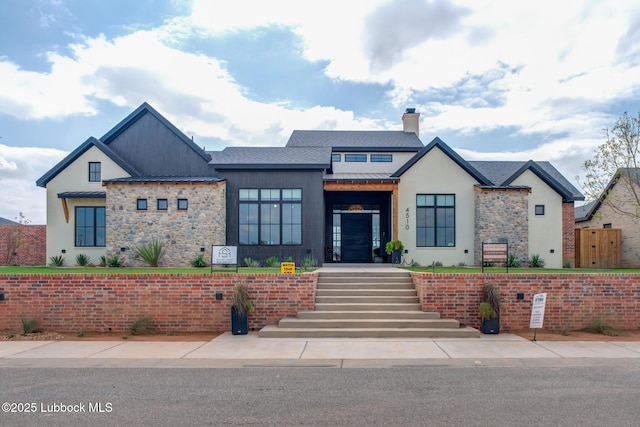 4510 Zadar Ave, Lubbock, TX 79407 - modern farmhouse style home featuring a standing seam roof, a metal roof, stone siding, and a chimney