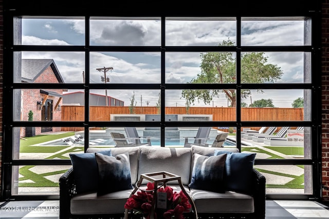 4510 Zadar Ave, Lubbock, TX 79407 - living area featuring healthy amount of natural light and brick wall