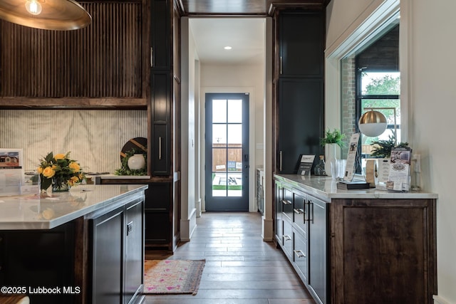4510 Zadar Ave, Lubbock, TX 79407 - kitchen featuring hardwood / wood-style floors, dark brown cabinets, and recessed lighting