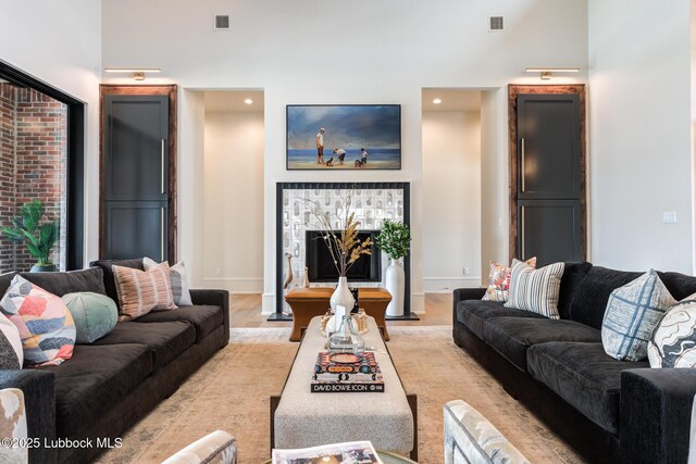 4510 Zadar Ave, Lubbock, TX 79407 - living area featuring light wood finished floors, a fireplace, and recessed lighting