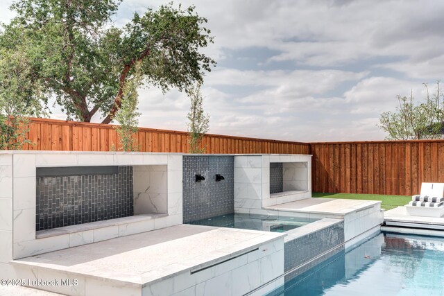 4510 Zadar Ave, Lubbock, TX 79407 - view of pool with an in-ground hot tub