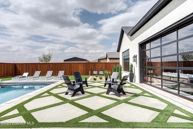 4510 Zadar Ave, Lubbock, TX 79407 - fenced backyard with a patio area