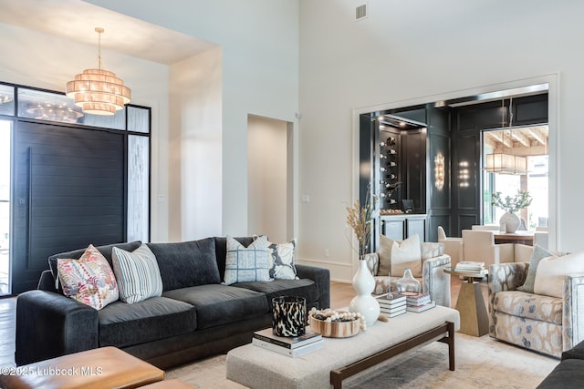 4510 Zadar Ave, Lubbock, TX 79407 - living area with a chandelier and a high ceiling