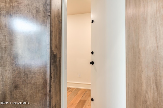 4510 Zadar Ave, Lubbock, TX 79407 - hallway with wood finished floors and baseboards