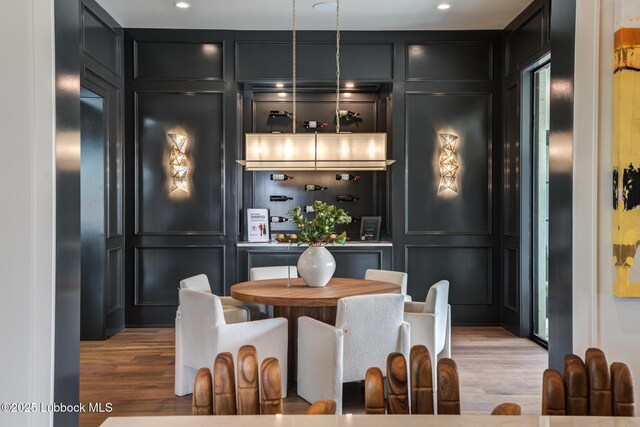 4510 Zadar Ave, Lubbock, TX 79407 - dining area with a decorative wall, wood finished floors, and recessed lighting