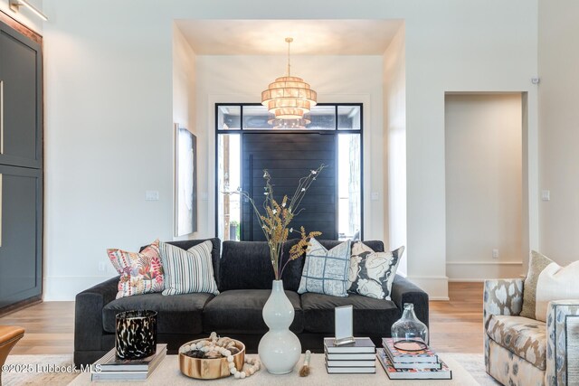 4510 Zadar Ave, Lubbock, TX 79407 - living area featuring a chandelier and wood finished floors