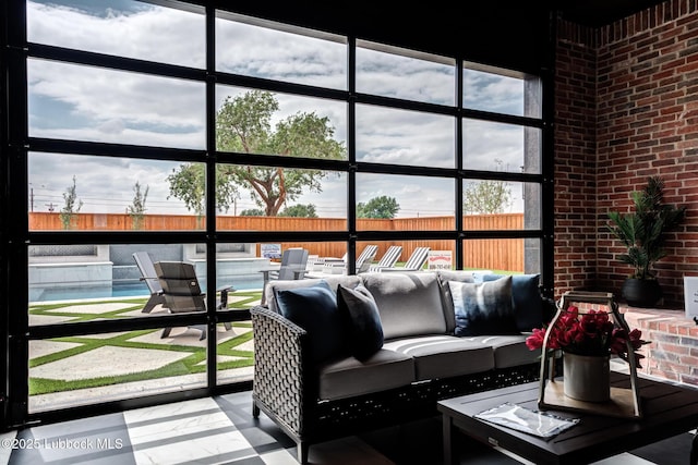 4510 Zadar Ave, Lubbock, TX 79407 - sunroom with brick wall