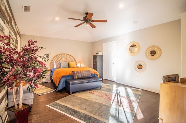 bedroom with dark wood-type flooring and ceiling fan