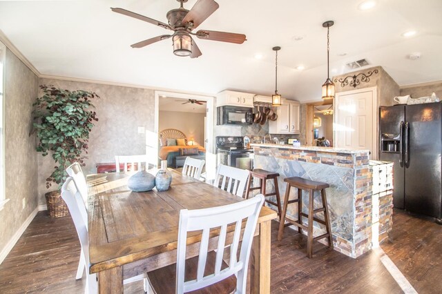 dining room featuring ceiling fan, ornamental molding, and dark hardwood / wood-style flooring