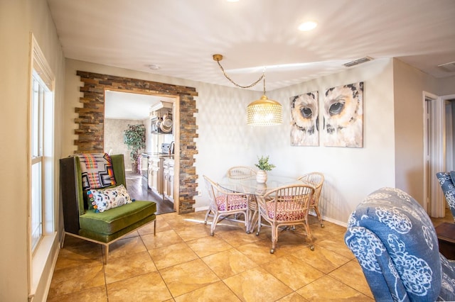 tiled dining room with plenty of natural light