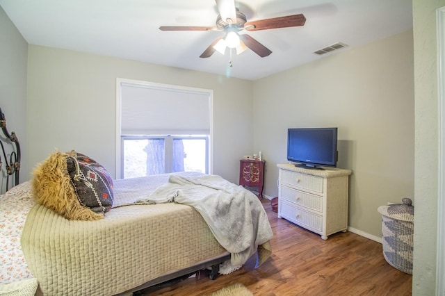 bedroom featuring wood-type flooring and ceiling fan