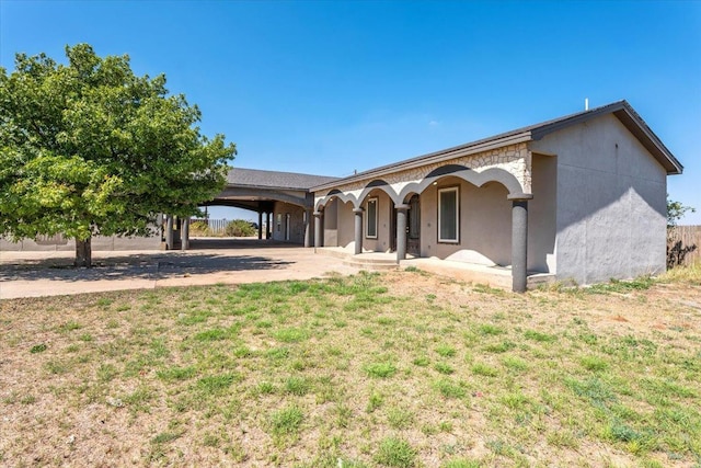 ranch-style home with a front lawn