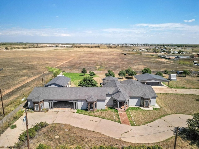 birds eye view of property with a rural view