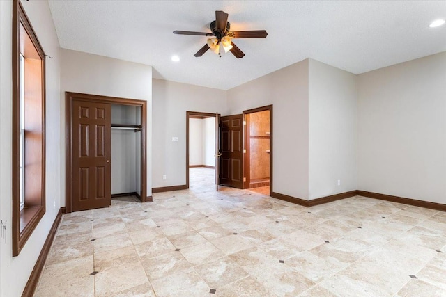 unfurnished bedroom with a closet and ceiling fan