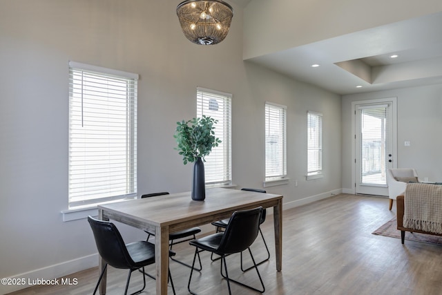 5713 119th St, Lubbock, TX 79424 - dining space with baseboards, light wood-style flooring, a chandelier, and recessed lighting