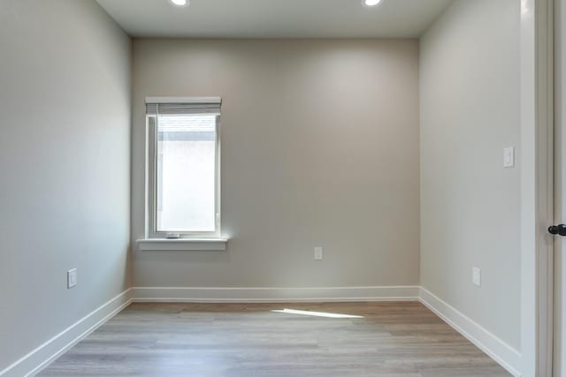5713 119th St, Lubbock, TX 79424 - empty room with light wood finished floors, recessed lighting, and baseboards