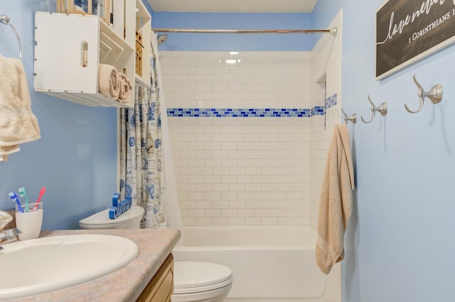 full bathroom with vanity, shower / tub combo, and toilet