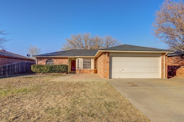 ranch-style house with a garage and a front yard