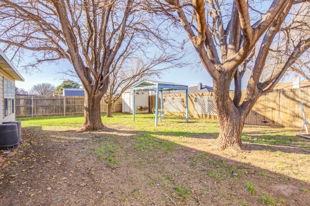 view of yard featuring a storage shed and central air condition unit