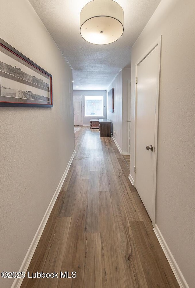 3410 53rd St, Lubbock, TX 79413 - hall featuring wood finished floors and baseboards