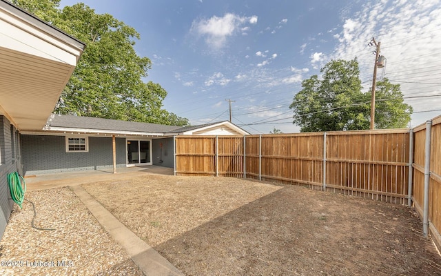 3410 53rd St, Lubbock, TX 79413 - fenced backyard featuring a patio area