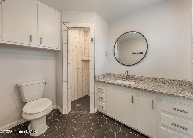3410 53rd St, Lubbock, TX 79413 - full bathroom featuring vanity, tile patterned flooring, and tiled shower