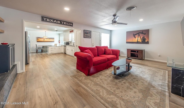 3410 53rd St, Lubbock, TX 79413 - living room with light wood finished floors, recessed lighting, and a ceiling fan